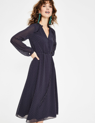 CLARA FLOCKED MIDI DRESS en oferta