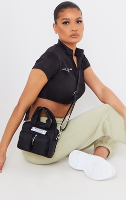 PRETTYLITTLETHING - Sac à bandoulière en nylon noir à doubles poches frontales, Noir